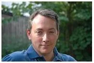 A headshot of the artist, Dan Black